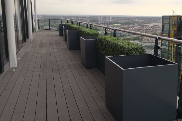 Bespoke metal planters on a roof terrace